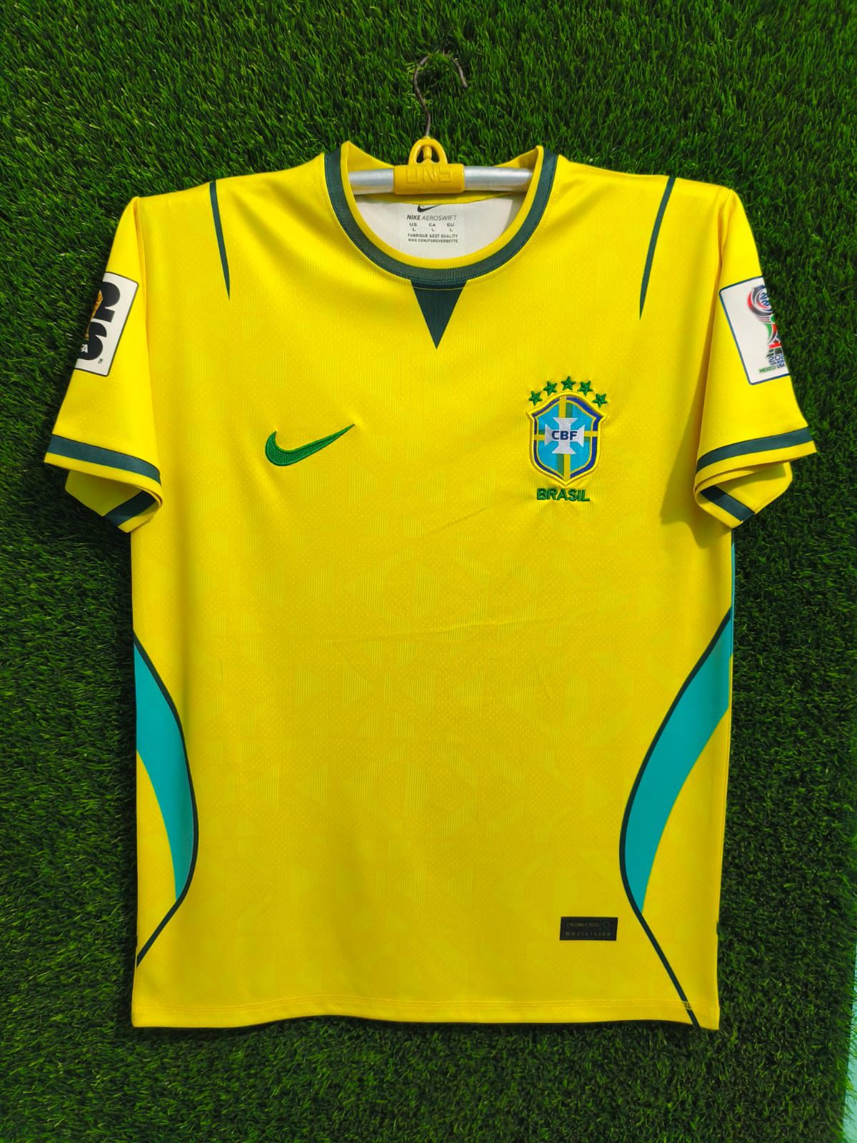 yellow Nike Brazil national team jersey features an embroidered CBF crest and green accents
